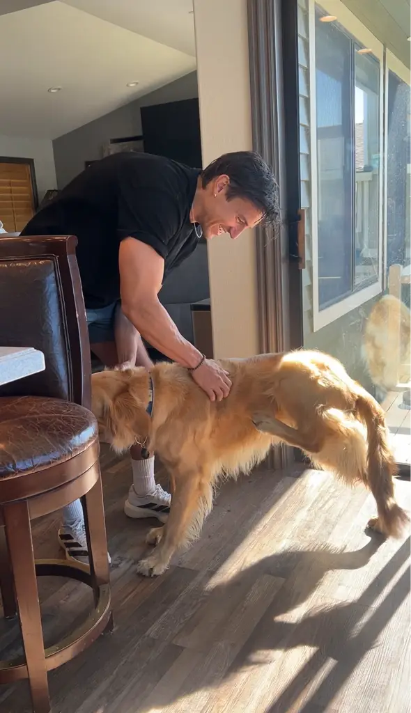 Alex with a golden retriever